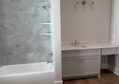 Bathroom with marble shower and quartz countertop Canton GA