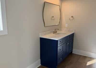 Bathroom vanity with blue cabinets and gold hardware Canton GA
