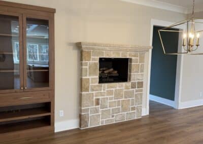 Dining area with stone fireplace in Canton GA custom home