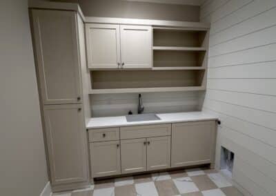 Laundry room with storage and sink Canton GA custom home