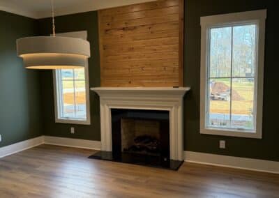 Living room with wood-accented fireplace in Canton Georgia home