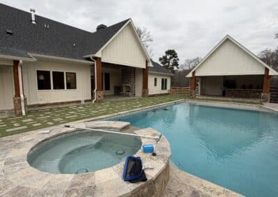 Rear exterior showing home and pool house Canton GA