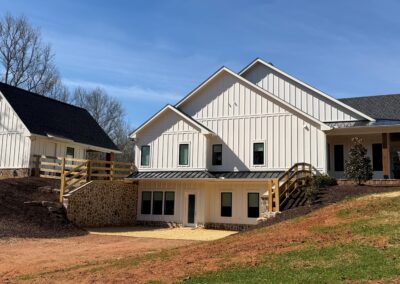 Side exterior view of custom home with estate lot setting in Canton Georgia