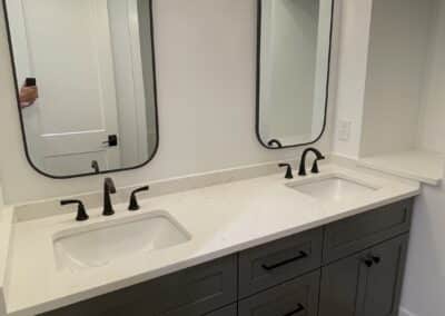 bathroom with double vanity and mirrors Gainesville GA home