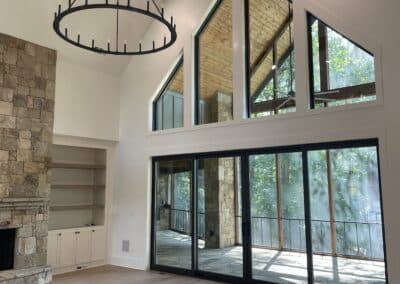 living room with floor to ceiling windows Gainesville GA lake home