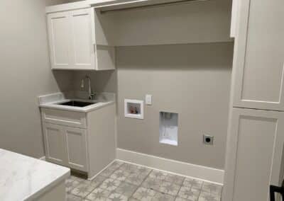 laundry room with sink and cabinetry Gainesville GA custom home