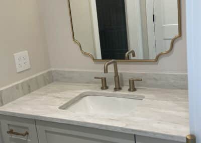 bathroom with white cabinets and gold hardware Gainesville GA