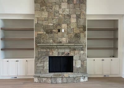 stone fireplace with built in shelving great room Gainesville GA
