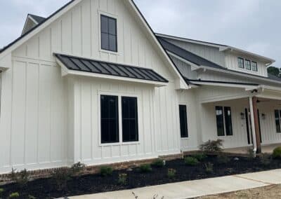 Modern farmhouse exterior with brick accent Canton Georgia