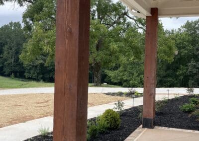 Front porch with wooden pillars modern farmhouse Canton GA