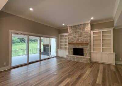 Living room with stone fireplace custom home Canton Georgia