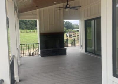 Outdoor fireplace covered porch Canton GA custom home