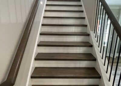 Staircase white risers dark wood tread Canton GA custom home